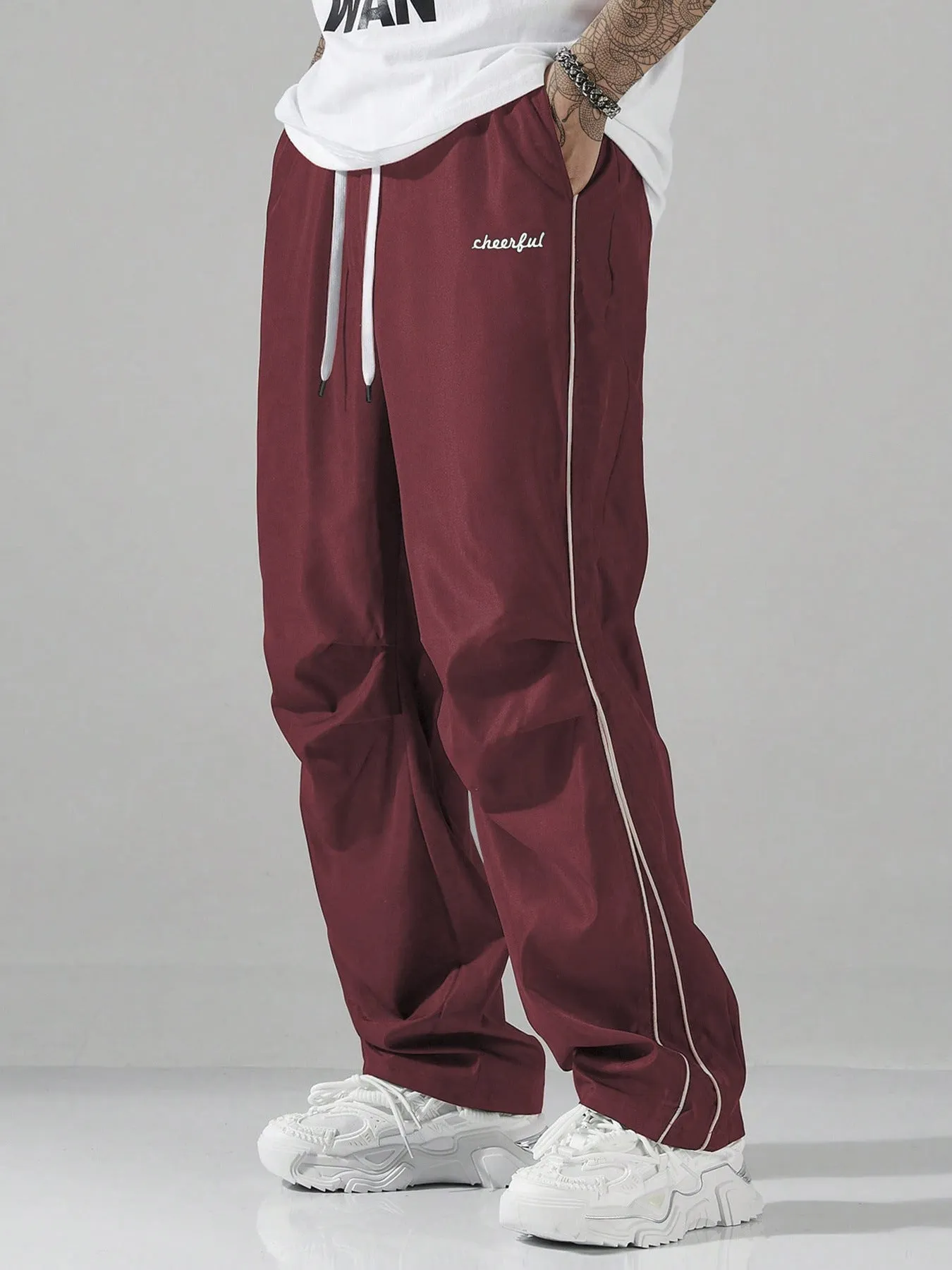 European high street charging paratrooper pants for teenagers, straight-leg acrylic blend trousers, elastic drawstring waist, side view