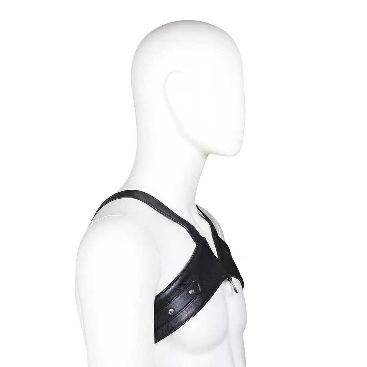 Black leather adjustable men's chest strap harness laid flat on a neutral background with adjustable fastener visible