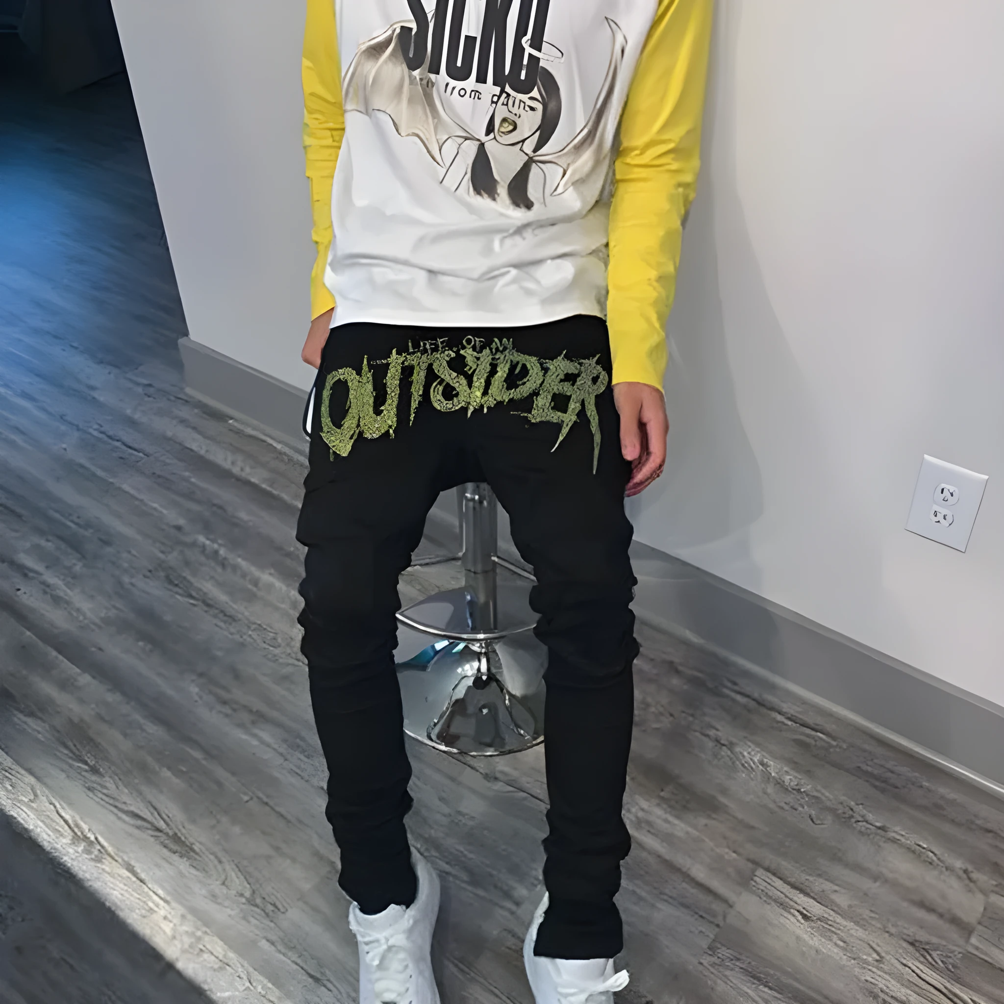 Men's black fashion ripped jeans with slim fit and distressed detailing, shown from front