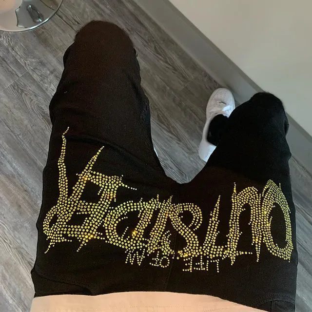 Men's black fashion ripped jeans with slim fit and distressed detailing, shown from front