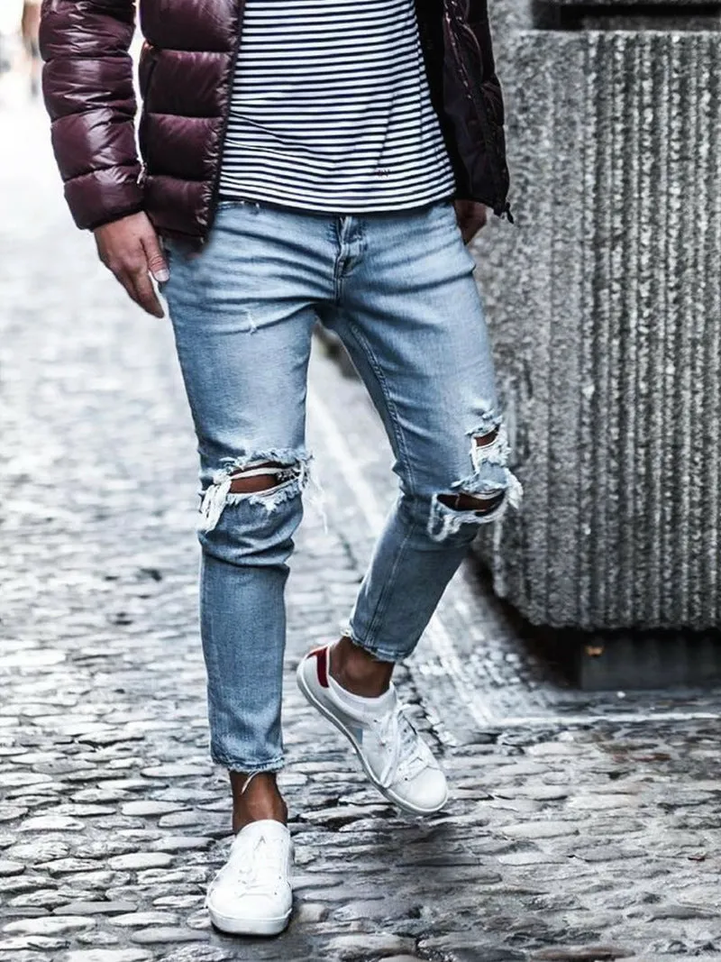 Men's light blue straight fit jeans with worn and embroidered detailing, five-point length, mid-rise waist