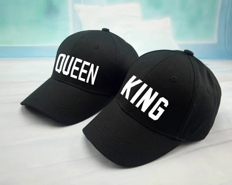 Black printed baseball cap with King design on front, adjustable back strap, on white background