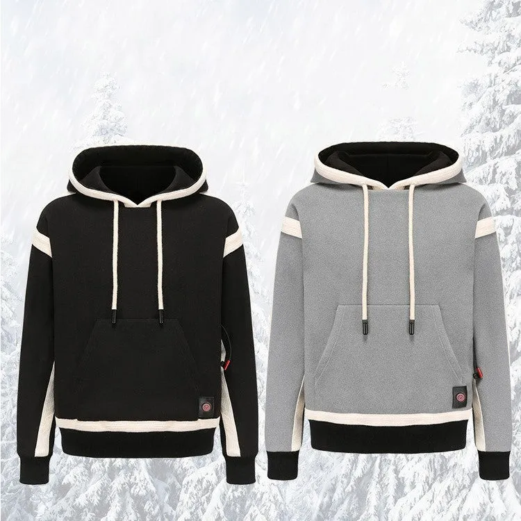 Women's USB heated jacket hoody in black, with brushed fabric and knitted construction, shown outdoors in cold weather