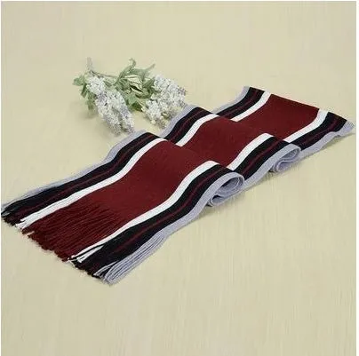Fringed cotton scarf in solid colour with stripe pattern, 180cm length, 23cm width, laid flat on neutral background