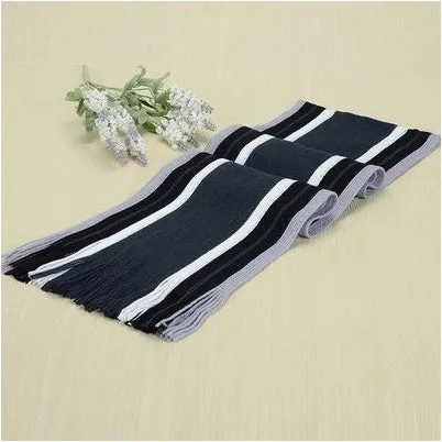 Fringed cotton scarf in solid colour with stripe pattern, 180cm length, 23cm width, laid flat on neutral background