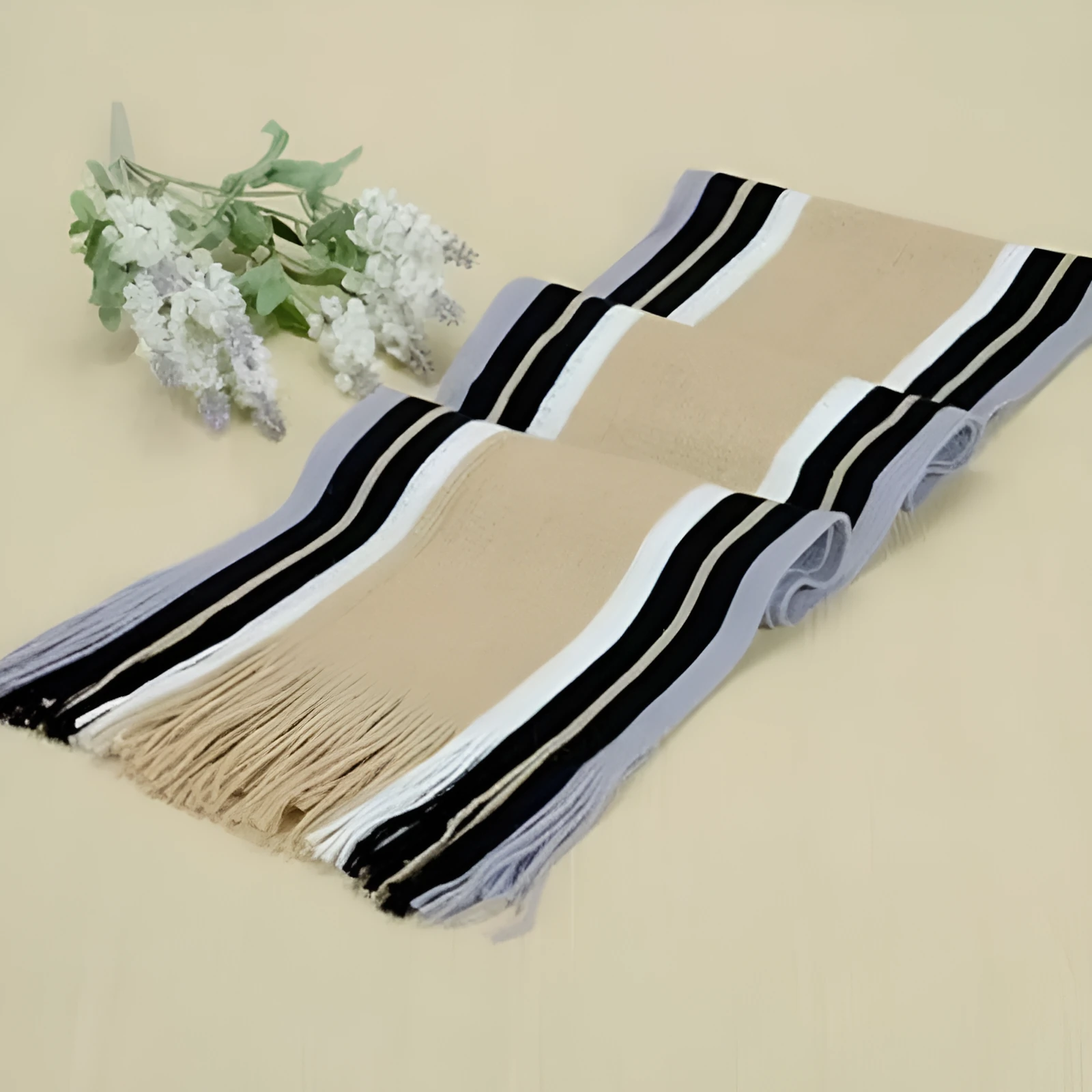 Fringed cotton scarf in solid colour with stripe pattern, 180cm length, 23cm width, laid flat on neutral background