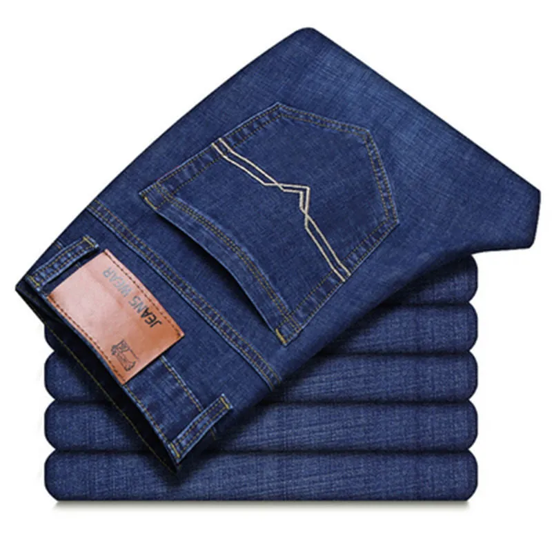 Men's loose straight casual work stretch jeans in blue elastic option with mid-waist and straight leg