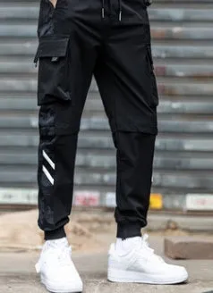 Men's straight-leg casual trousers in black nylon blend fabric with micro-elastic waist on a plain background