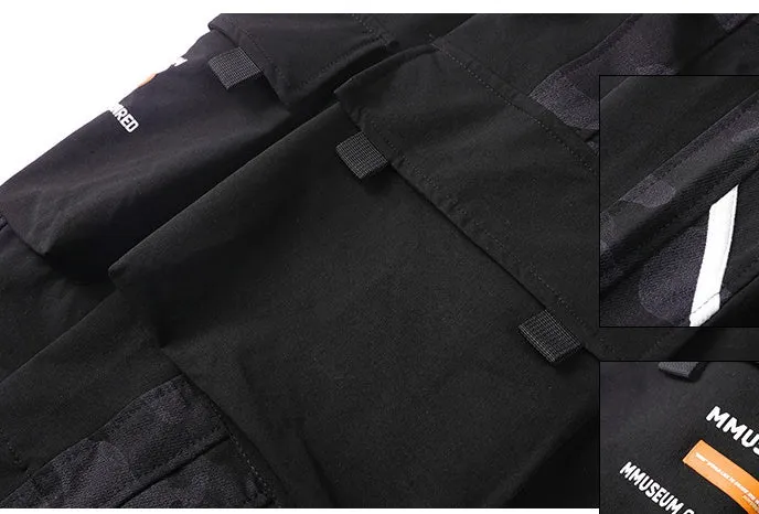 Men's straight-leg casual trousers in black nylon blend fabric with micro-elastic waist on a plain background