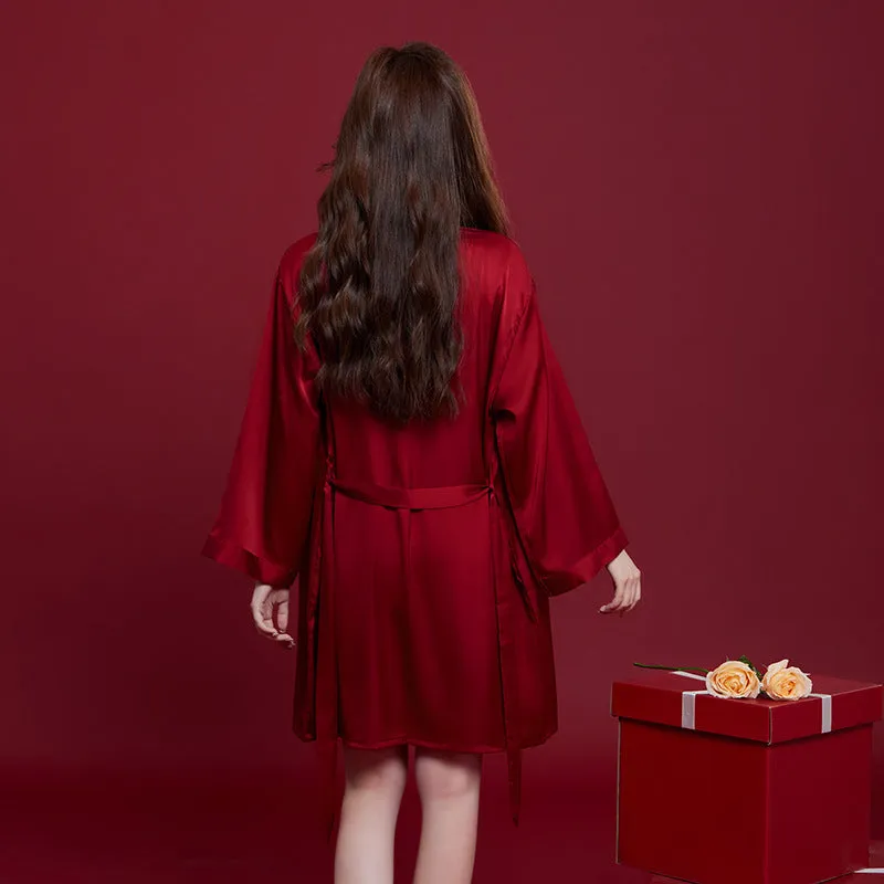 Red long-sleeved ice silk sleepwear set for a man and woman laid out flat.
