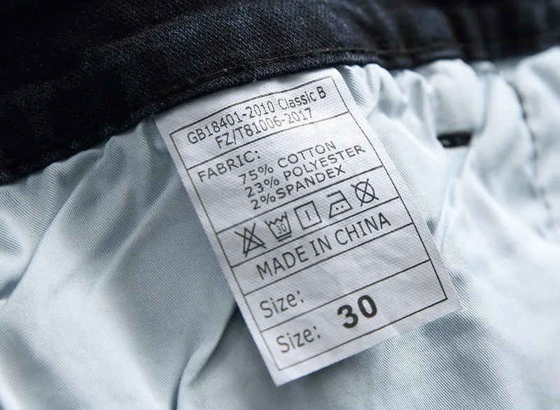 Men's blue and white faded cotton denim jeans with distressed worn finish, straight leg style