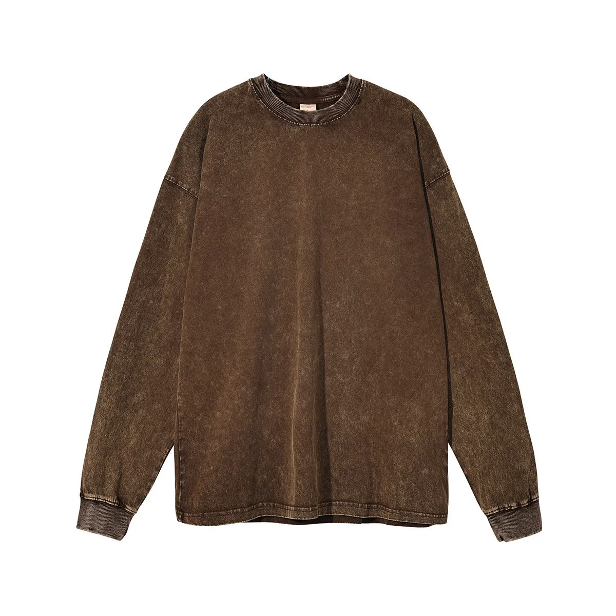 Man wearing a loose-fit batik print long sleeve cotton pullover top in a vintage washed colour.