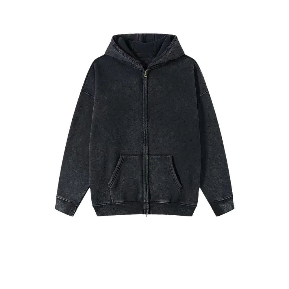 Man wearing a washed black cotton fleece-lined hooded cardigan with a double zipper front.