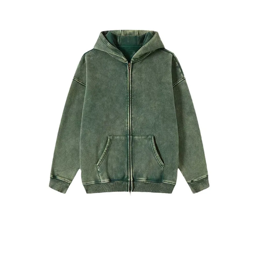 Man wearing a washed black cotton fleece-lined hooded cardigan with a double zipper front.