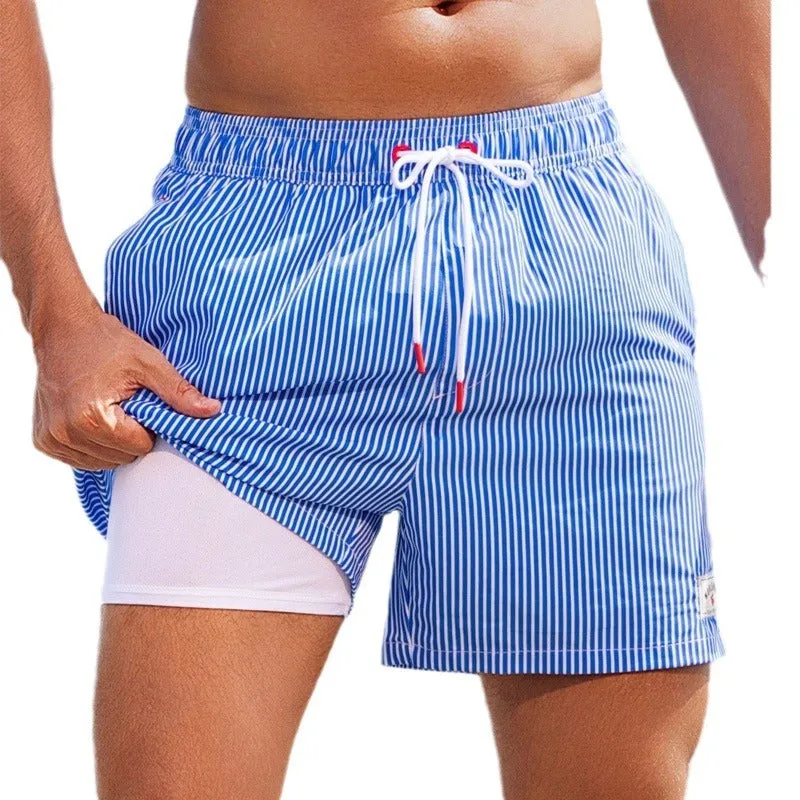Man wearing loose green boxer-style swimming trunks made from quick-drying spandex fabric.