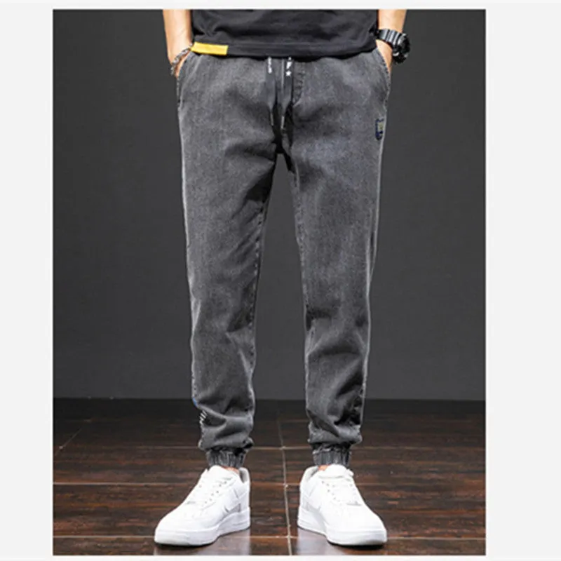 Men's casual loose stretch cotton jeans in black, available in sizes M to 8XL for relaxed daily wear
