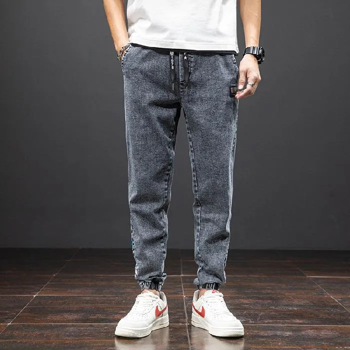 Men's casual loose stretch cotton jeans in black, available in sizes M to 8XL for relaxed daily wear