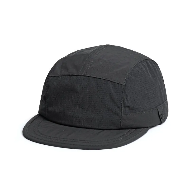 Polyester bucket hat in army green with a soft front brim and dome crown on a wooden background.