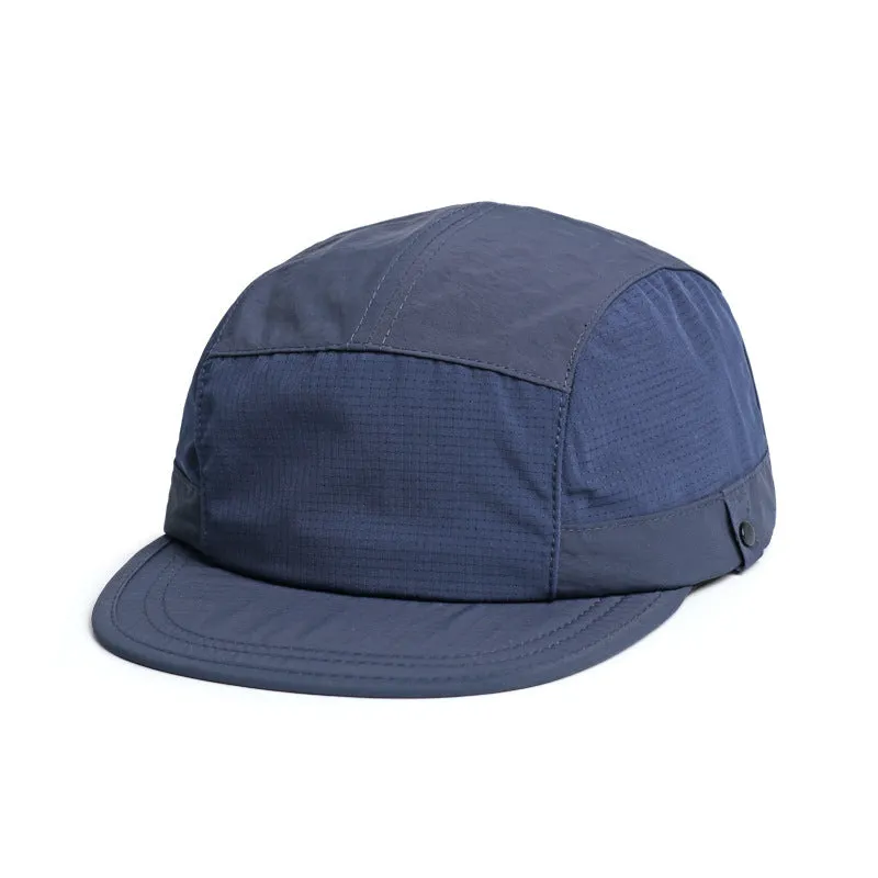 Polyester bucket hat in army green with a soft front brim and dome crown on a wooden background.