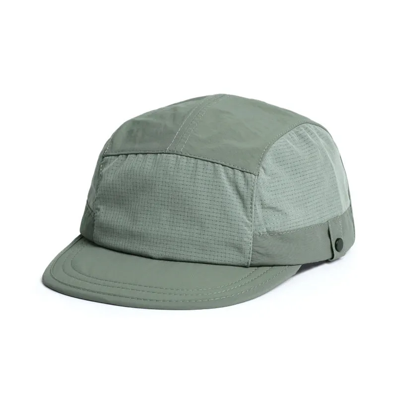 Polyester bucket hat in army green with a soft front brim and dome crown on a wooden background.