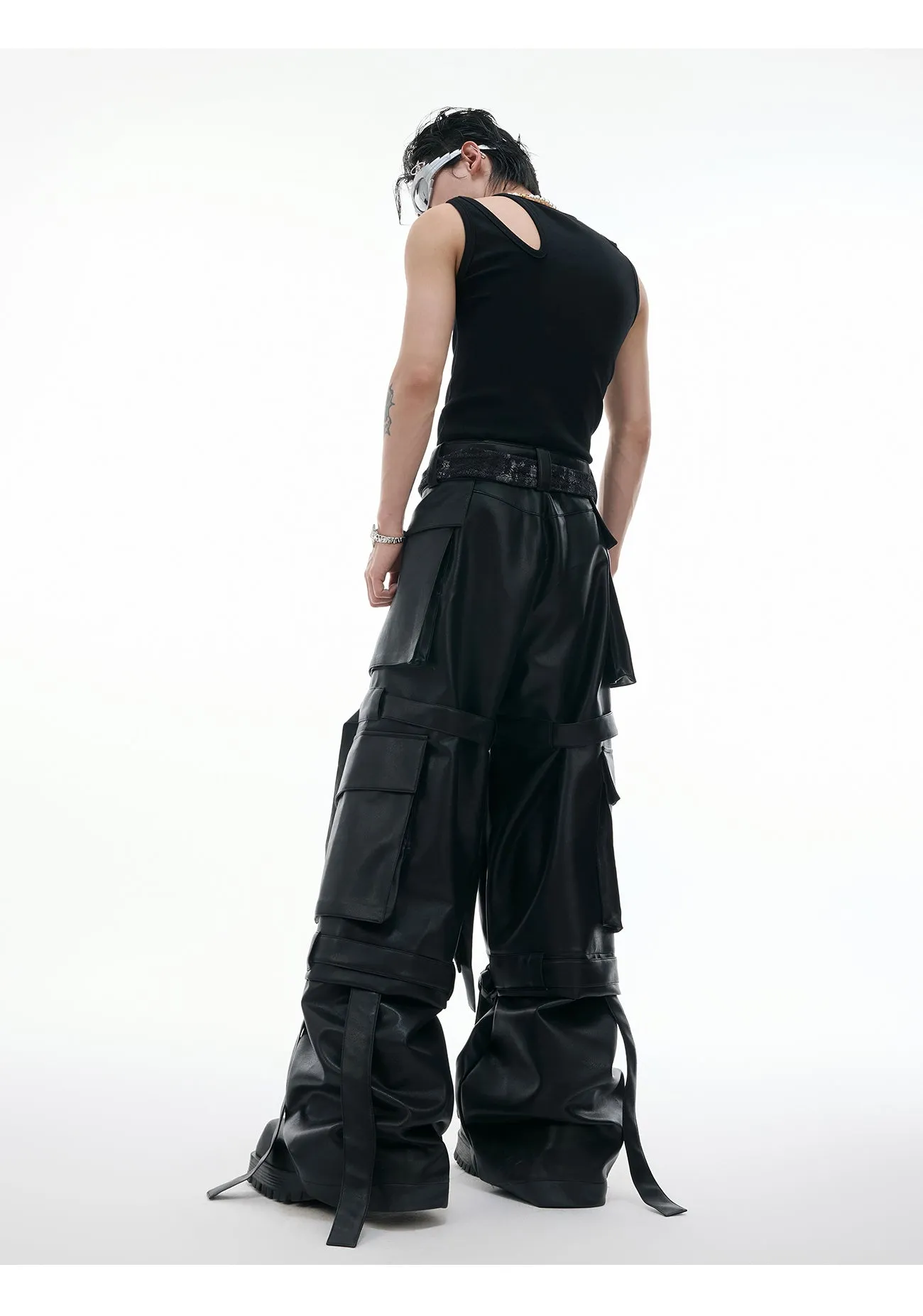 Black quilted loose-fit trousers with multiple pockets and leather-like appearance