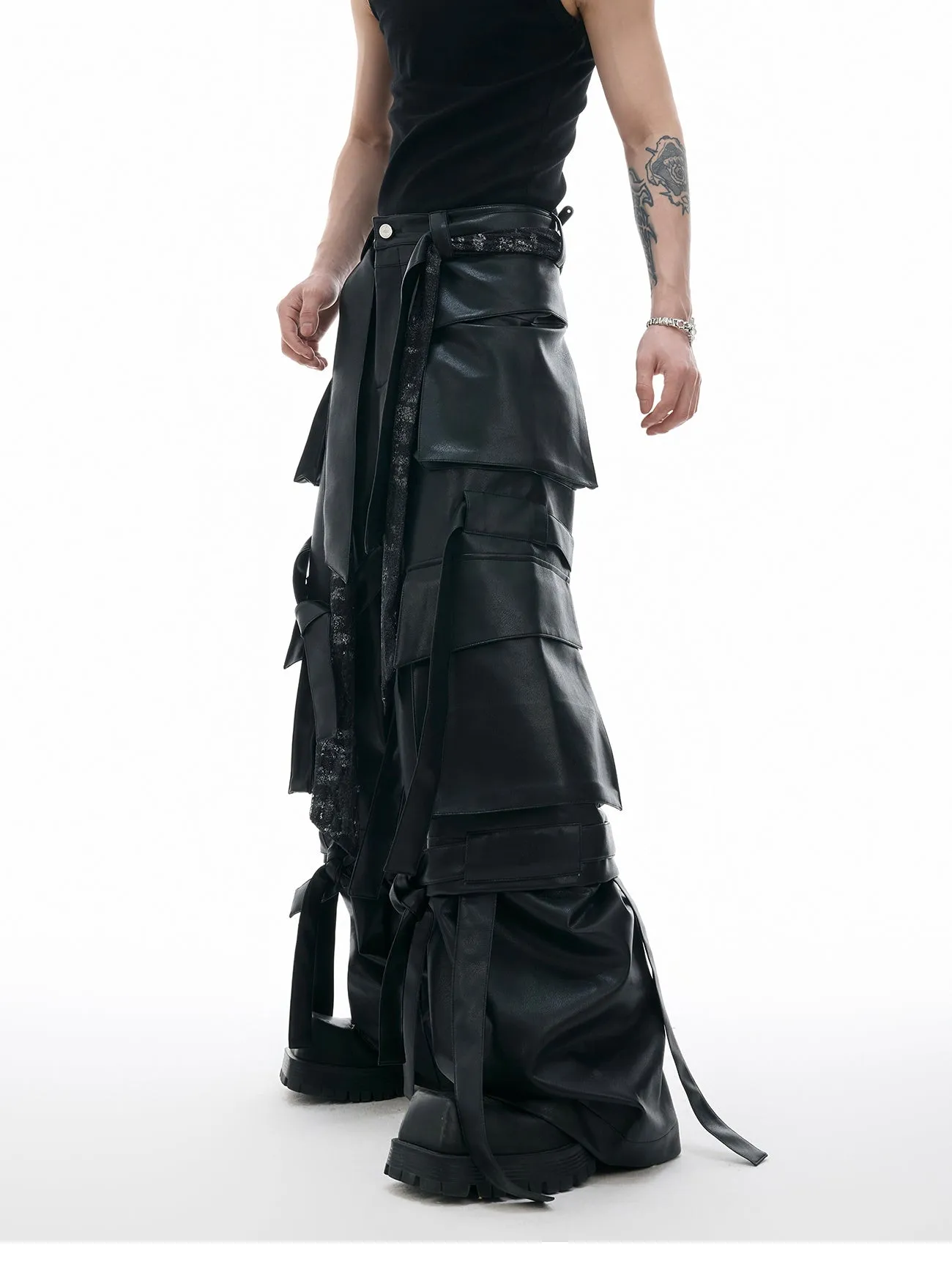 Black quilted loose-fit trousers with multiple pockets and leather-like appearance