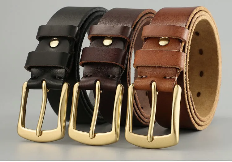 Handmade casual men's cowhide belt with needle buckle and leather decoration, black colour, on a plain background
