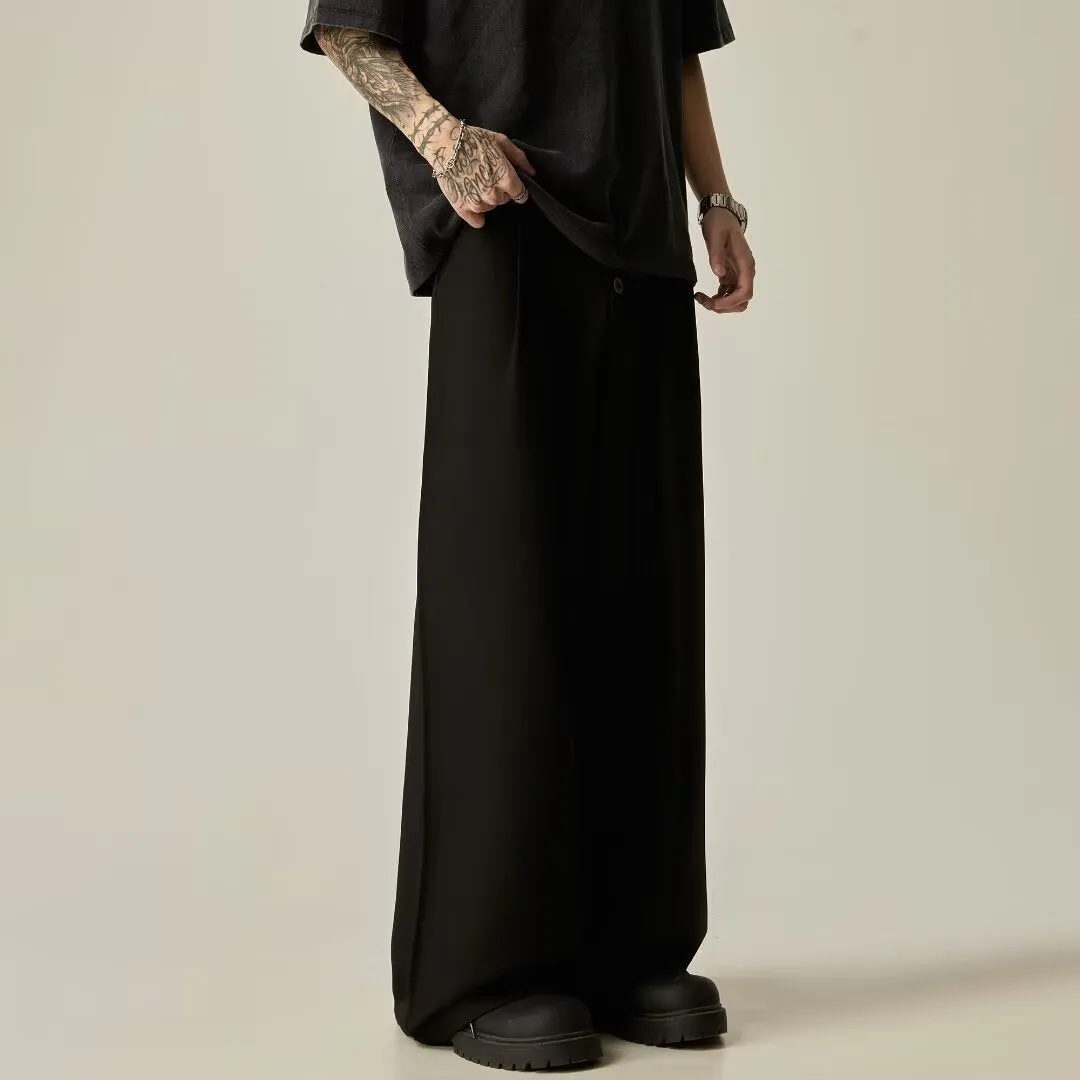 Men's solid black wide-leg casual trousers with a vertical tube design on a mid-waist.