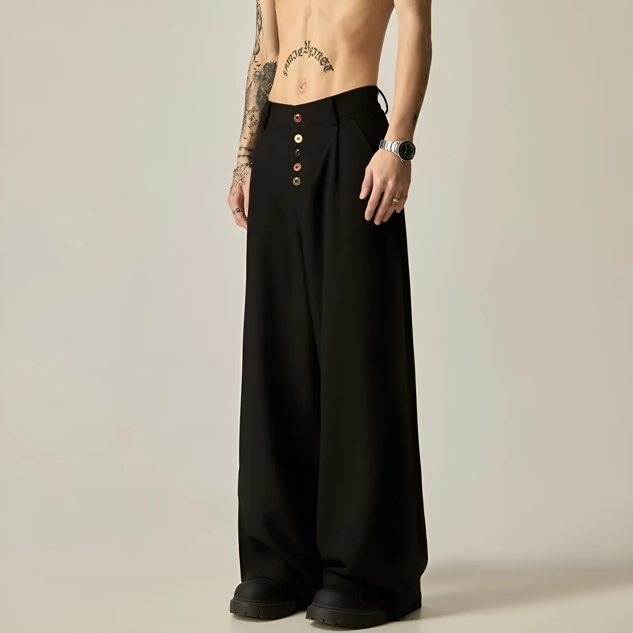 Men's solid black wide-leg casual trousers with a vertical tube design on a mid-waist.