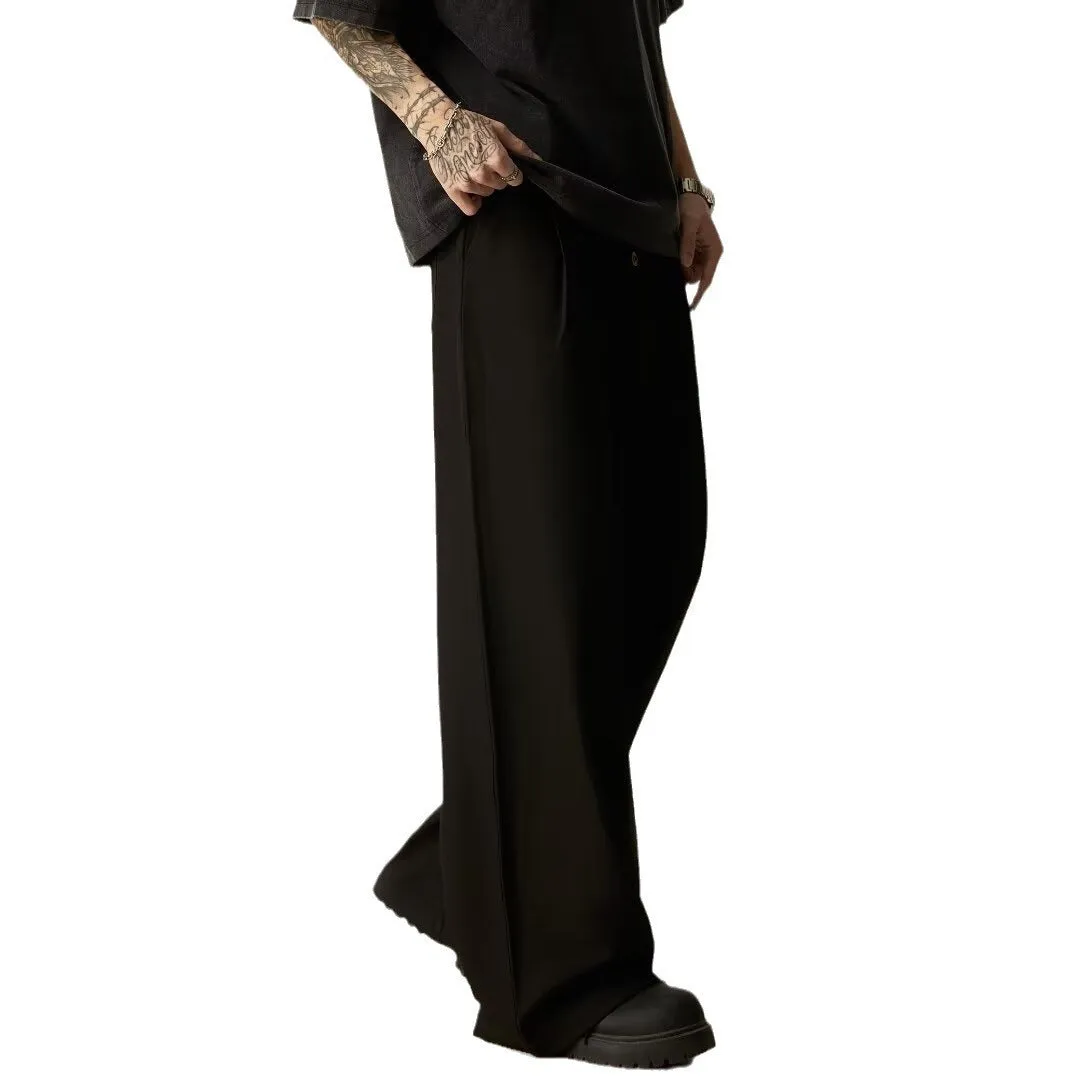 Men's solid black wide-leg casual trousers with a vertical tube design on a mid-waist.
