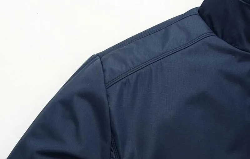 Men's blue extra wide polyester casual jacket with stand collar and zip front on display.