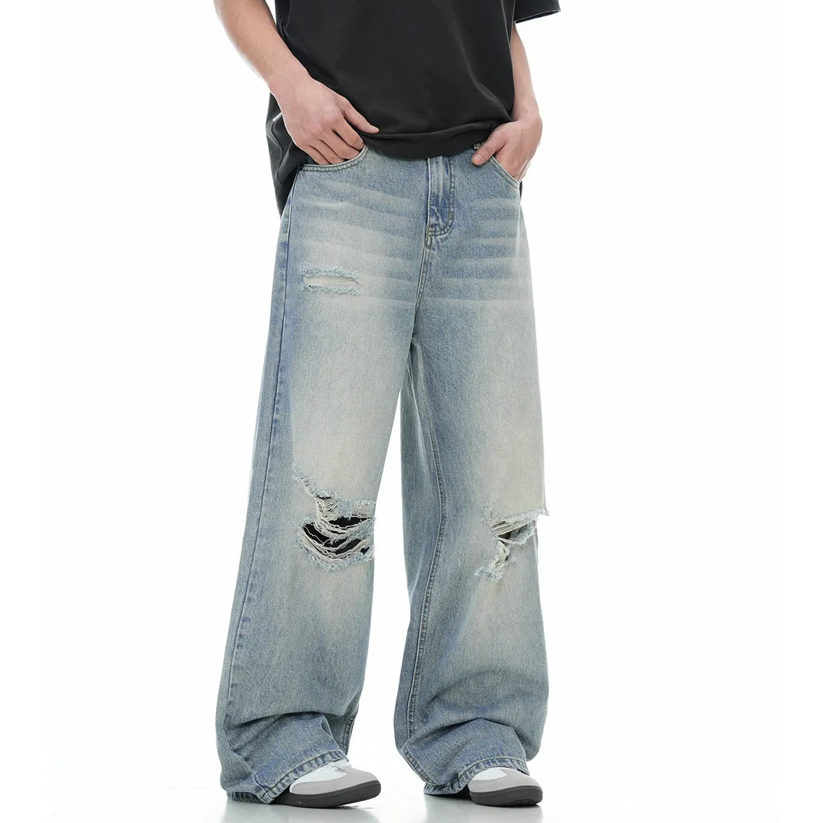 Blue retro straight-leg jeans with ripped details on a mannequin.