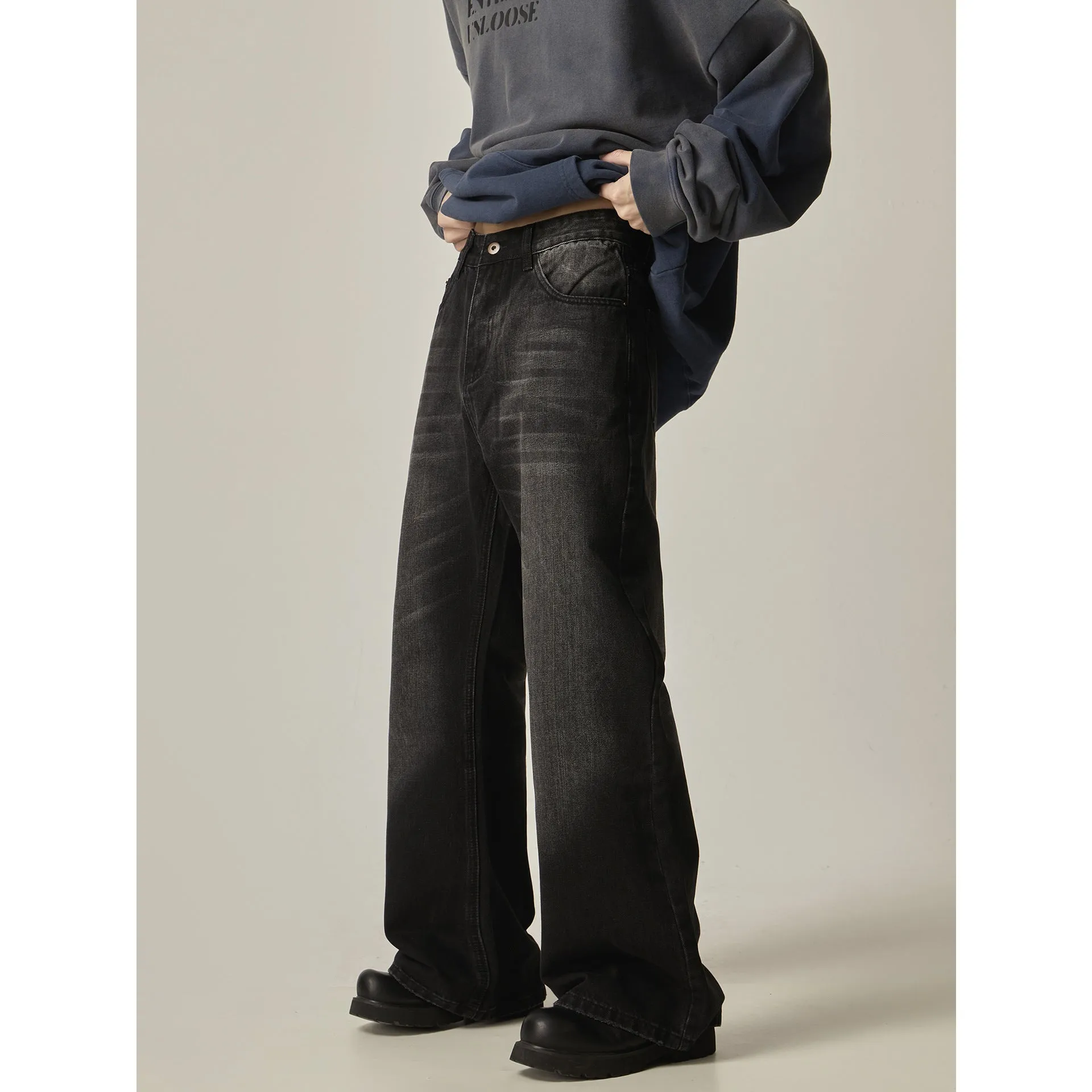 Black loose straight retro jeans showing front and back views with five-pocket design