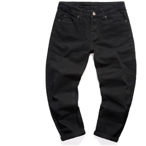 Slim-fit stretch cotton men's pants in black, laid flat showing tight cut and full length