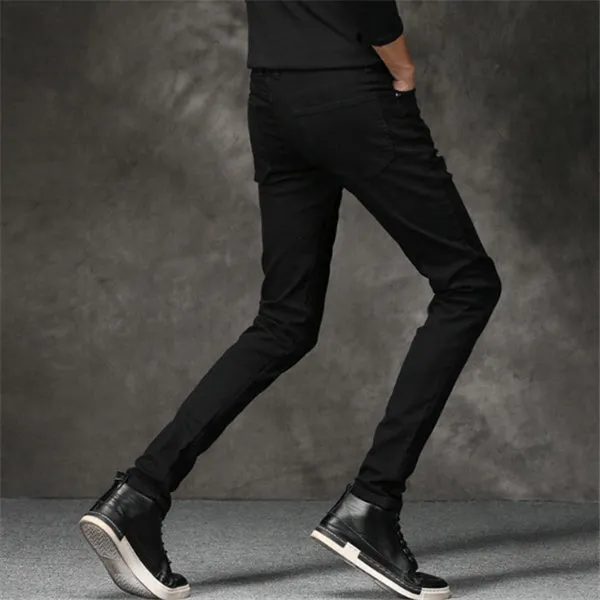 Slim-fit stretch cotton men's pants in black, laid flat showing tight cut and full length
