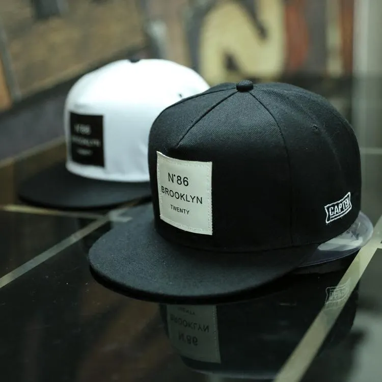 Adjustable cotton polyester baseball cap with short brim and curved eaves in black dome top style