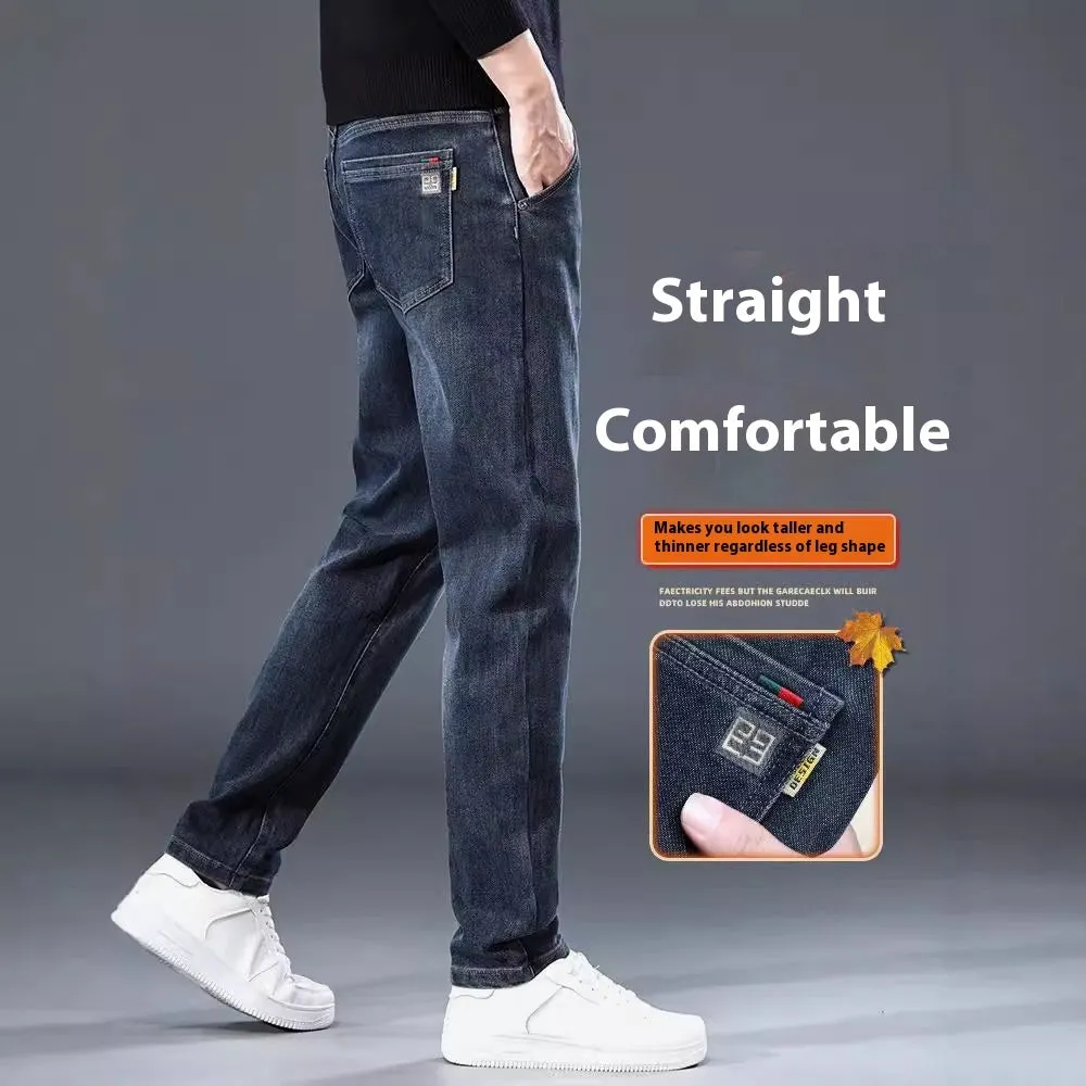 Blue grey men's slim straight casual trousers with a mid waist and zip fly on a neutral background.