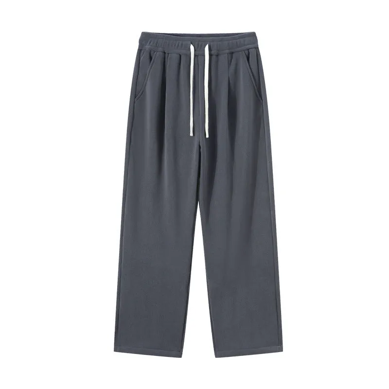 Men's apricot coloured double-sided polar fleece winter pants with a loose fit and drawstring waist.