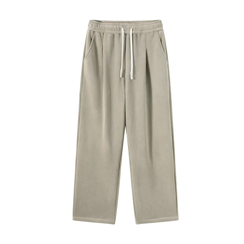Men's apricot coloured double-sided polar fleece winter pants with a loose fit and drawstring waist.