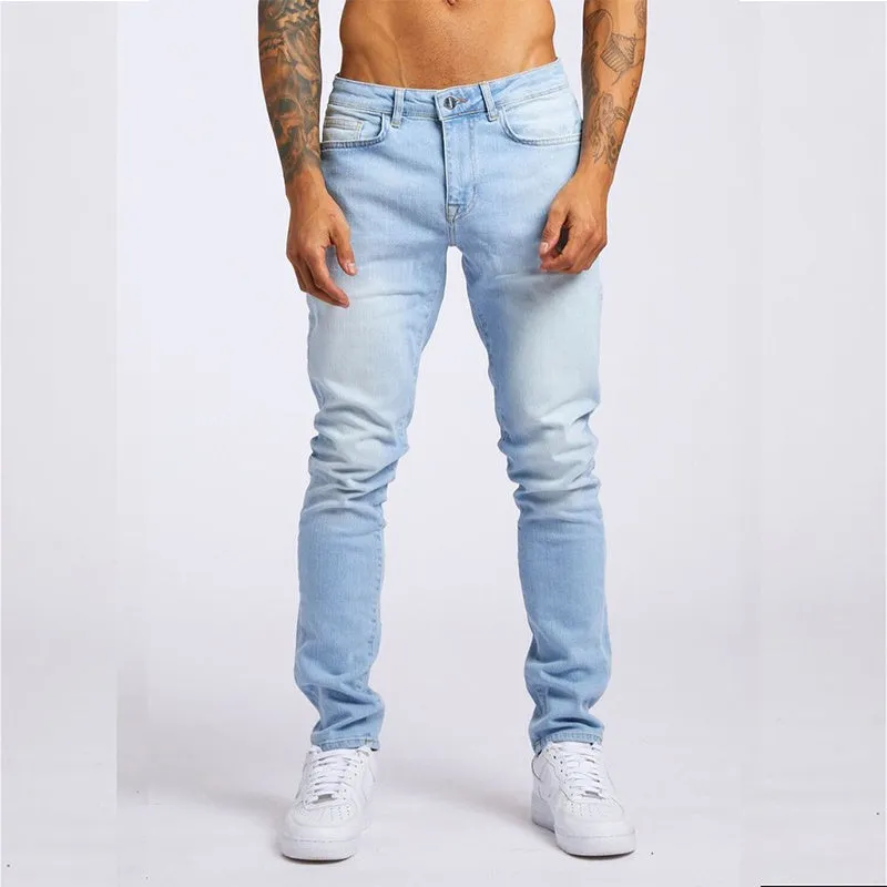 Men's fashion casual slim fit high waist jeans in light blue cotton with solid colour finish