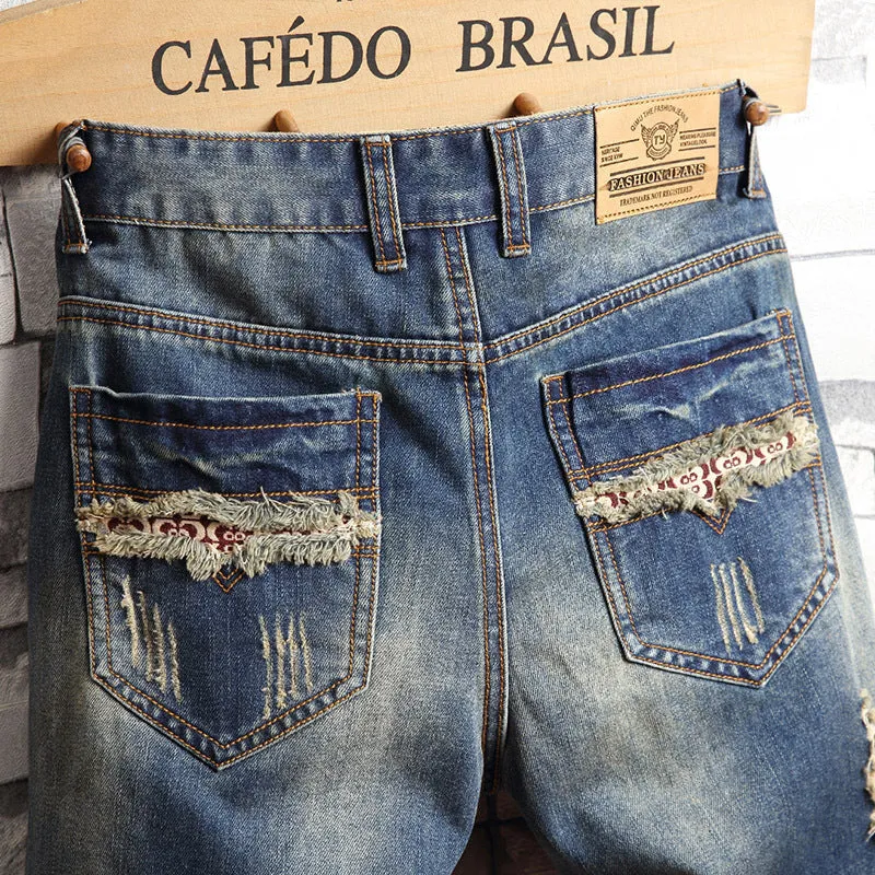 Men's blue denim capri shorts with big hole distressing, straight leg, zip fly, and mid-rise waist