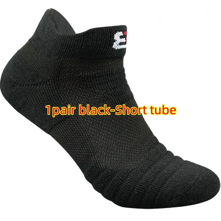 Three pairs of plain colour cotton blend socks in black, white, and grey