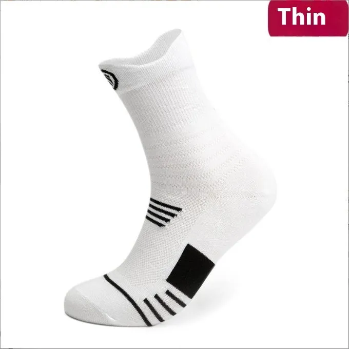 Three pairs of plain colour cotton blend socks in black, white, and grey