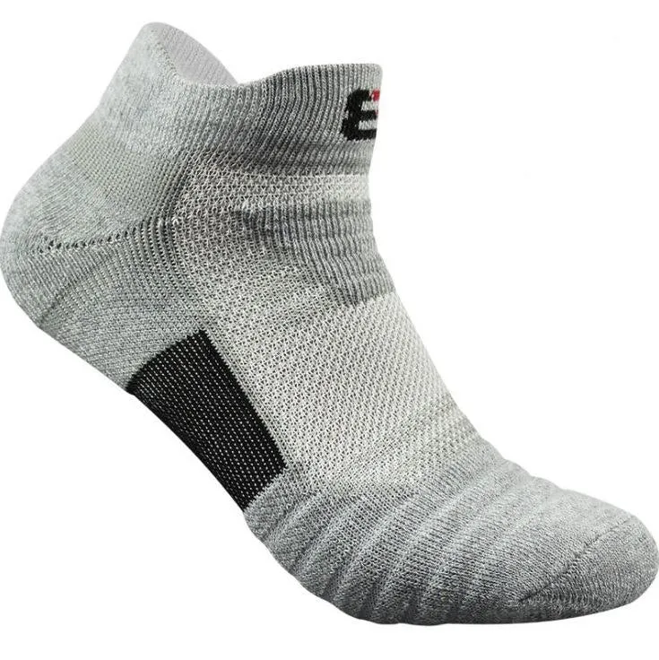 Three pairs of plain colour cotton blend socks in black, white, and grey