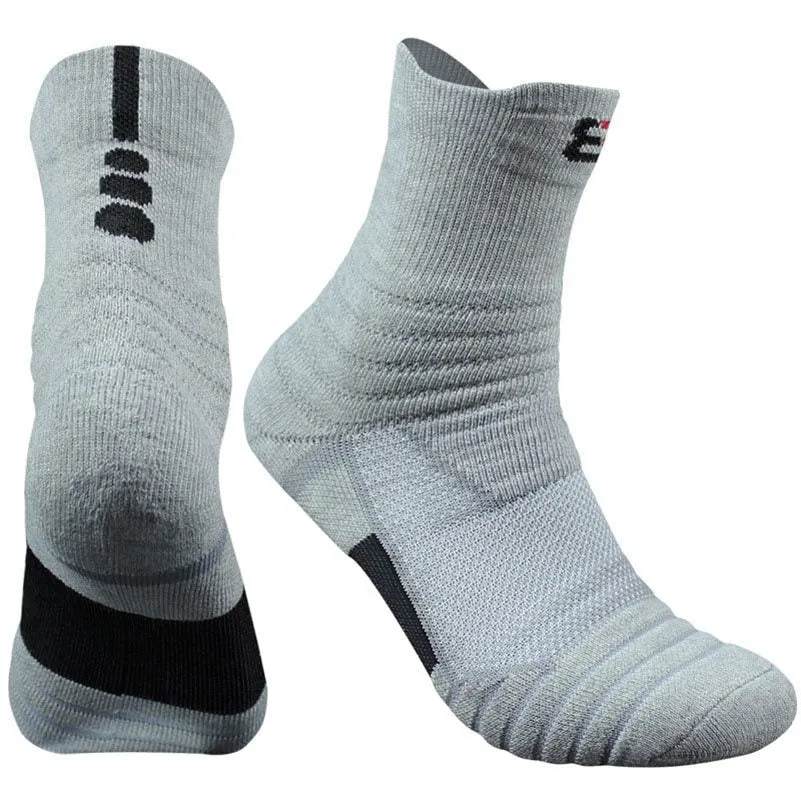 Three pairs of plain colour cotton blend socks in black, white, and grey