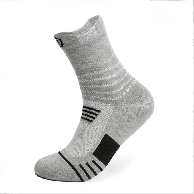 Three pairs of plain colour cotton blend socks in black, white, and grey