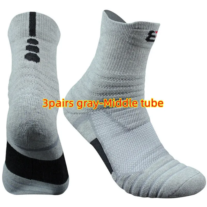 Three pairs of plain colour cotton blend socks in black, white, and grey