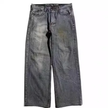 Gray washed-out denim jeans on a man, showing straight wide-leg cut and vintage workwear style.