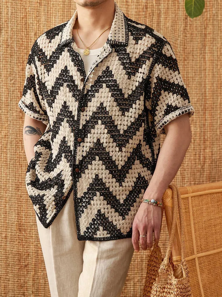 Beach knitted short-sleeved cardigan in black with lapel collar and loose fit on a woman