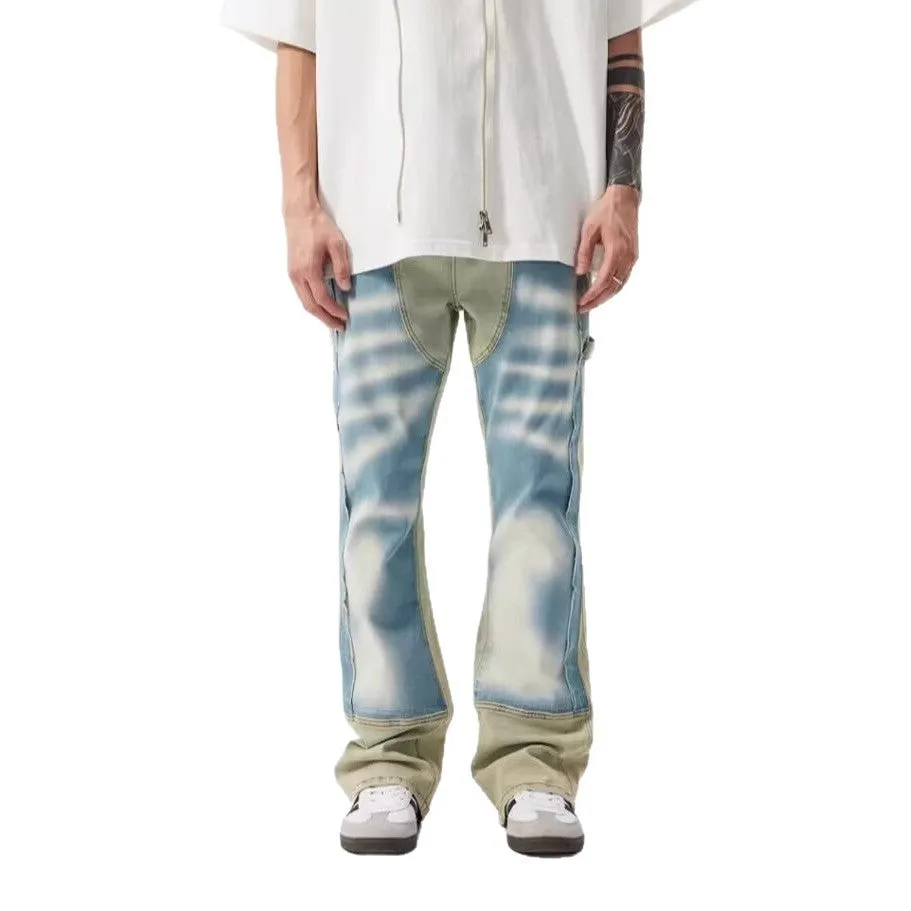 Yellow and blue retro patchwork jeans with splash-ink distressed design and zip fly.